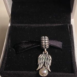 Retired “Guardian Angel” dangle Pandora charm